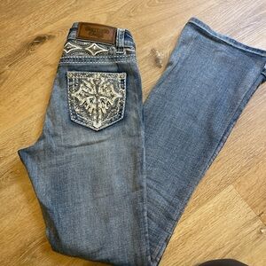Blue Boot Cut Jeans with Embellished Pockets